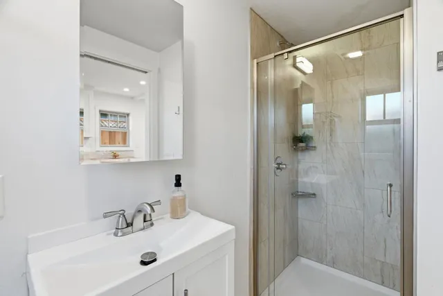 a bedroom with a bed and a potted plant