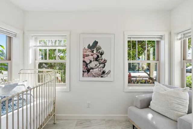 a backyard of a house with outdoor seating