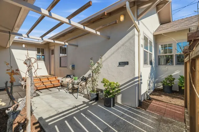 a view of a house with wooden fence