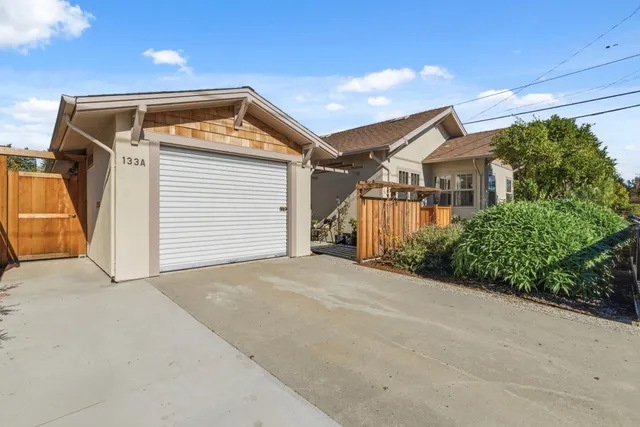 a view of a houses with a city street