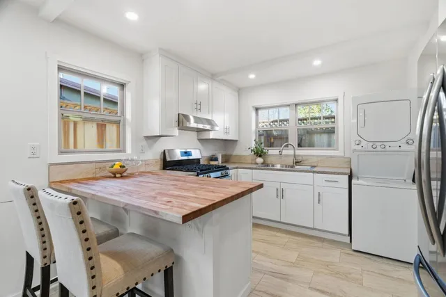 a view of a dining room with furniture and a window