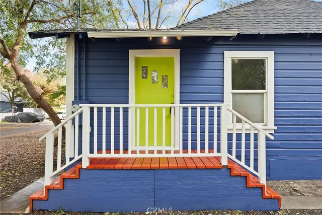 a view of balcony with a door and wooden floor