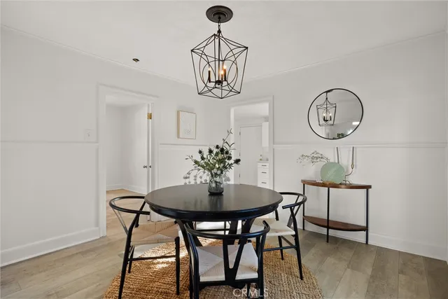 a table room with furniture and wooden floor