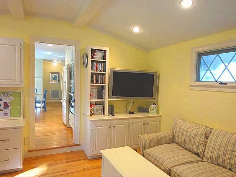 48 Pleasant Street Portsmouth, RI 02871 - Photo 14 of 25 Den/Family/Great Room. The desks and cabinets were custom made . The house has surround sound and the equipment is stored here.