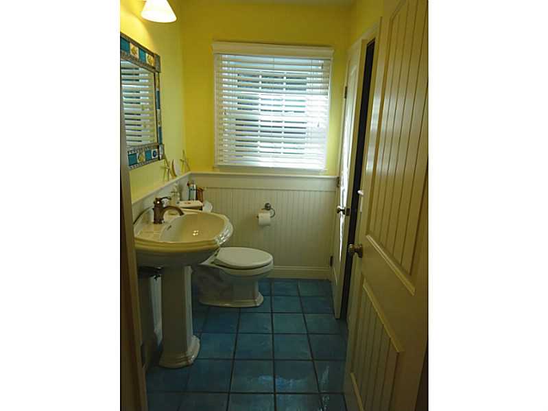 48 Pleasant Street Portsmouth, RI 02871 - Photo 21 of 25 Bathroom. The first floor lavette has beautiful blue tile flooring, beadboard wainscotting, linen closet and new doors. As with the rest of the home , this was totally renovated.