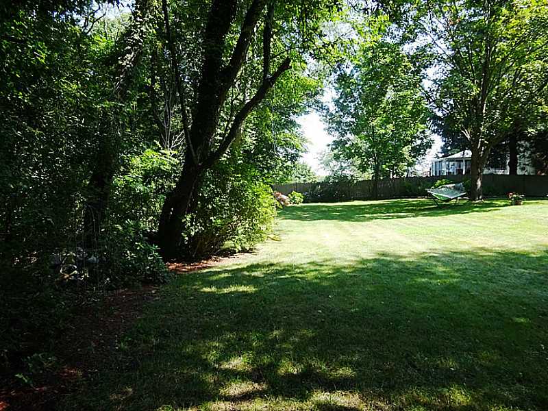 48 Pleasant Street Portsmouth, RI 02871 - Photo 6 of 25 Yard/Garden. Another view of the yard. with the stonewall border to the left
