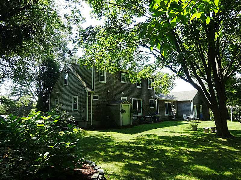 48 Pleasant Street Portsmouth, RI 02871 - Photo 7 of 25 Exterior Back. When the house was renovated in 2007, the wood shingles were replaced as were the windows and the steel basement interior door . The roof was replaced in 2012