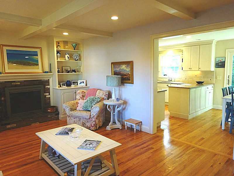48 Pleasant Street Portsmouth, RI 02871 - Photo 9 of 25 Living Room. The Living room measures approx. 22 x 13 and flows into the Dining area and Kitchen. The coffered ceilings in this room and in the family room were design elements of the original structure.