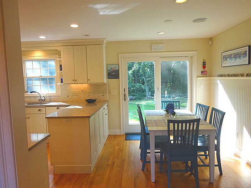 48 Pleasant Street Portsmouth, RI 02871 - Photo 10 of 25 Dining Room. Beadboard topped by a display ledge customizes the dining area. This west facing area brings in much natural lightening and is a perfect location to watch the birds at any time of day.