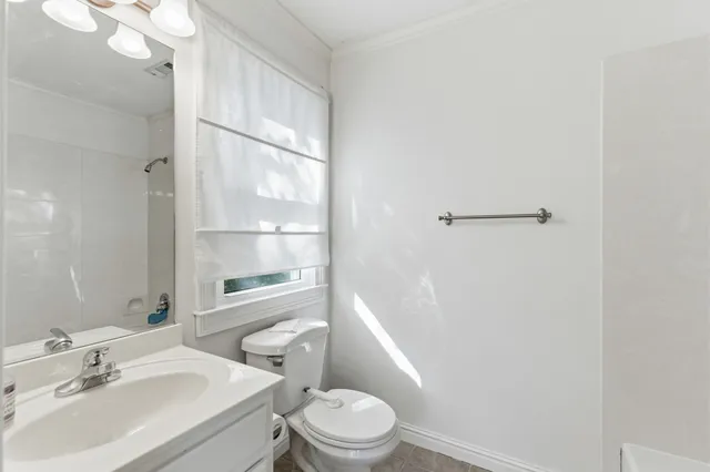 a bathroom with a sink vanity and a mirror
