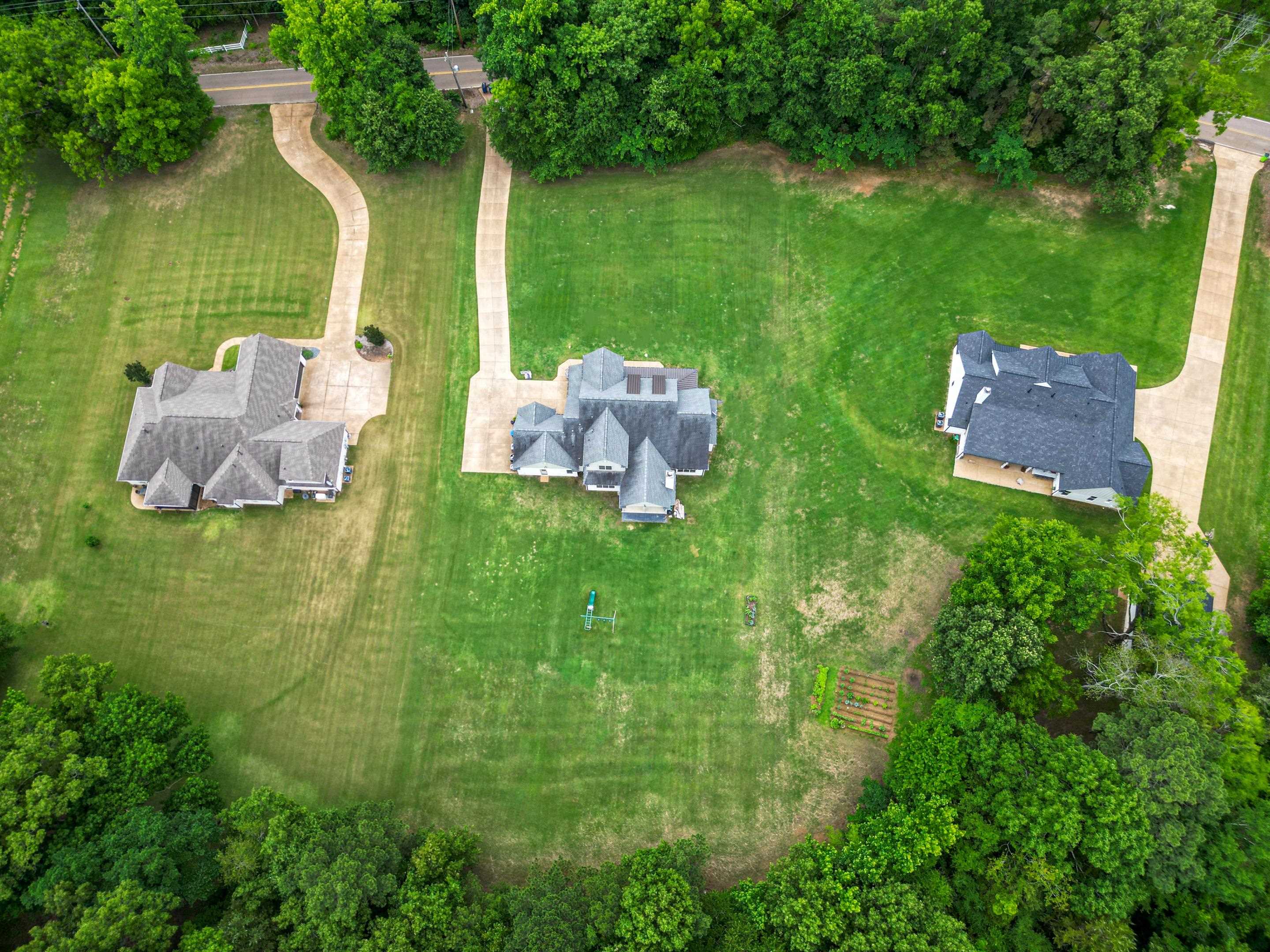 10354 Pleasant Ridge Road Arlington, TN 38002 - Photo 37 of 40 Exceptional aerial perspective showcasing the full scale of the property, oversized homesite, and tranquil wooded backdrop perfect for luxury country living.
