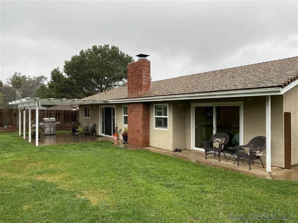 911 La Buena Vida Fallbrook, CA 92028 - Photo 19 of 24 a front view of house with a garden and patio