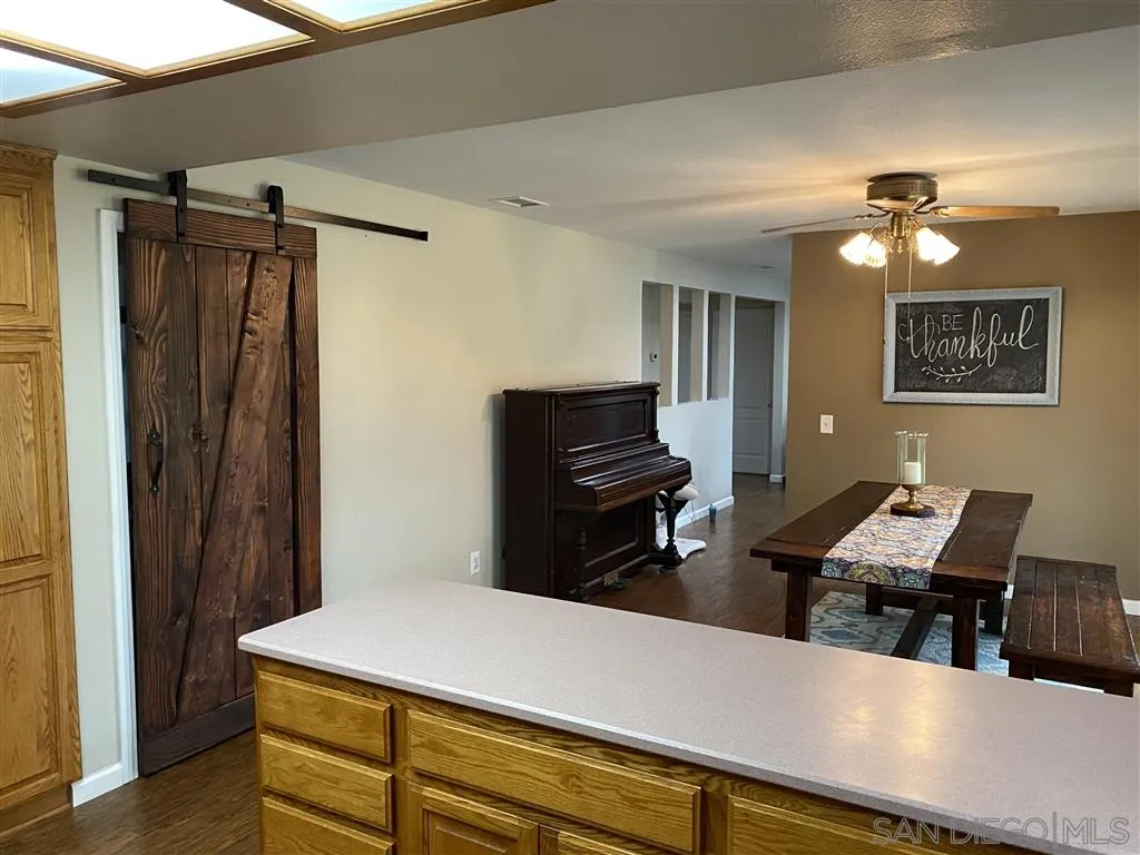 911 La Buena Vida Fallbrook, CA 92028 - Photo 6 of 24 a workspace with furniture and window