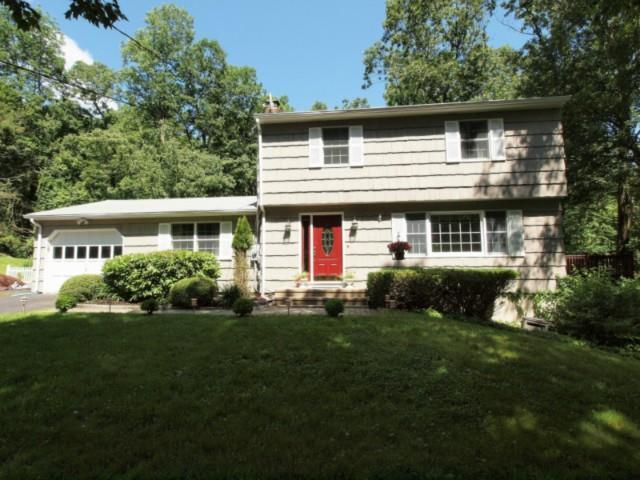 92 Castle Hill Road Newtown, CT 06470 - Photo 1 of 1 a front view of a house with a yard