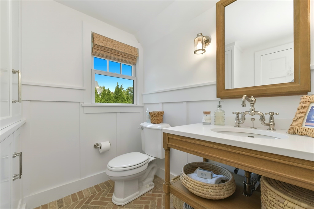 8 Port Pines Road Harwich Port, MA 02646 - Photo 17 of 42 a bathroom with a sink a toilet and mirror