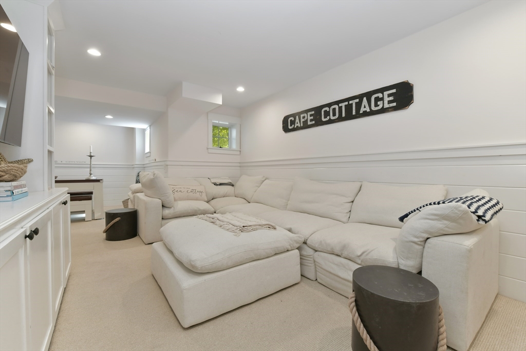 8 Port Pines Road Harwich Port, MA 02646 - Photo 26 of 42 a living room with furniture and a wooden floor