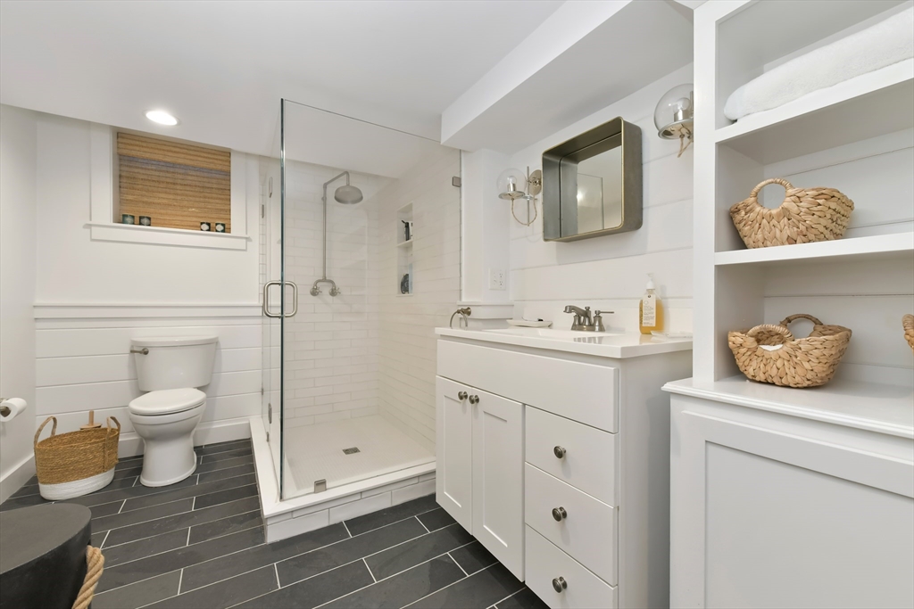 8 Port Pines Road Harwich Port, MA 02646 - Photo 30 of 42 a bathroom with a granite countertop toilet sink and shower
