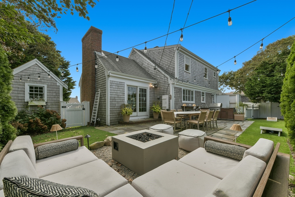8 Port Pines Road Harwich Port, MA 02646 - Photo 33 of 42 a view of a house with couches chairs and wooden floor