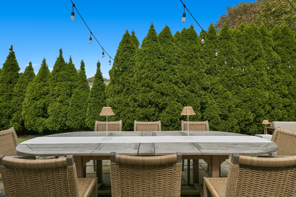 8 Port Pines Road Harwich Port, MA 02646 - Photo 34 of 42 a terrace with a table and chairs