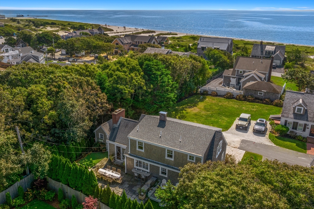 8 Port Pines Road Harwich Port, MA 02646 - Photo 40 of 42 an aerial view of a house with garden space and outdoor seating