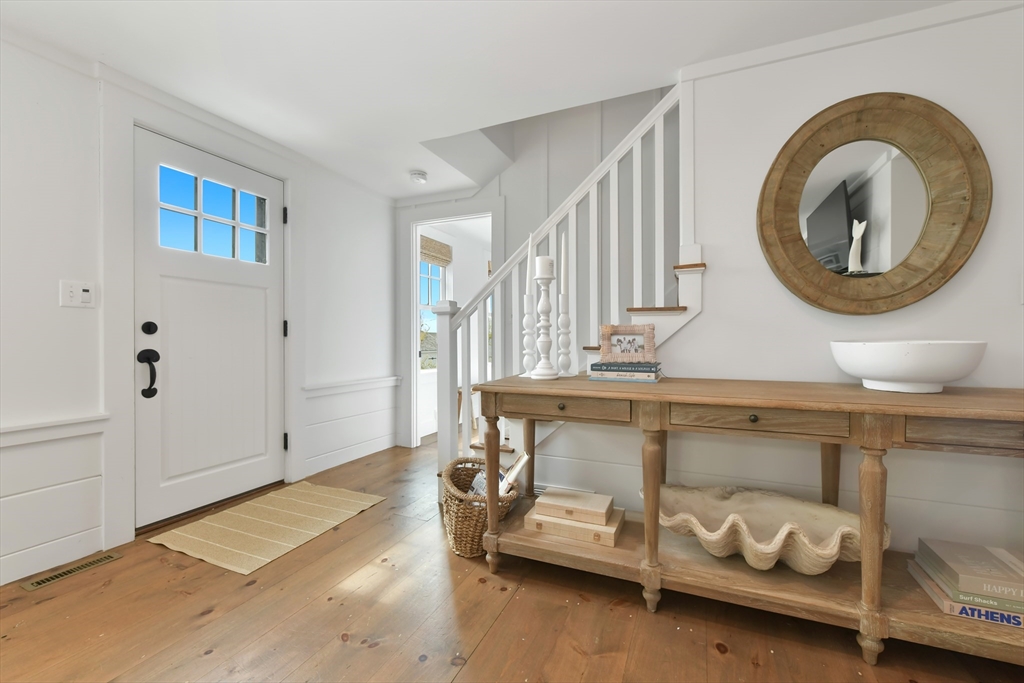 8 Port Pines Road Harwich Port, MA 02646 - Photo 7 of 42 a room with furniture and a mirror