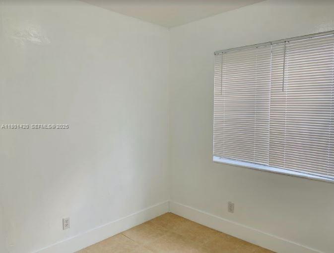 691 Northeast 86th Street, Unit 3 Miami, FL 33138 - Photo 7 of 10 a small space with a window