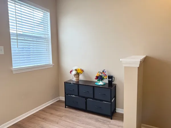 a room with furniture and wooden floor