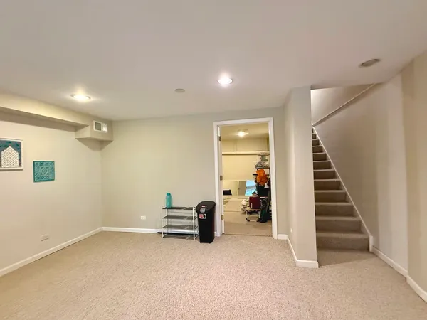 a view of room with stairs and closet
