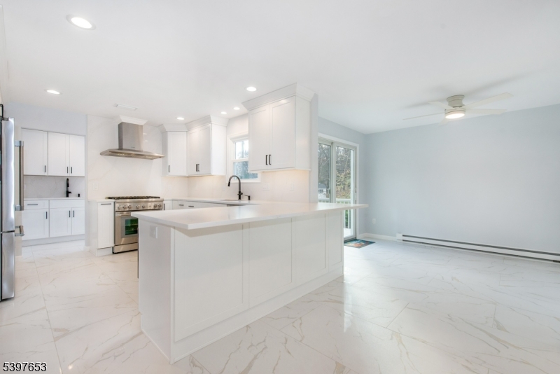 267 Washington Valley Road Randolph, NJ 07869 - Photo 14 of 42 a kitchen with stainless steel appliances granite countertop a sink and cabinets