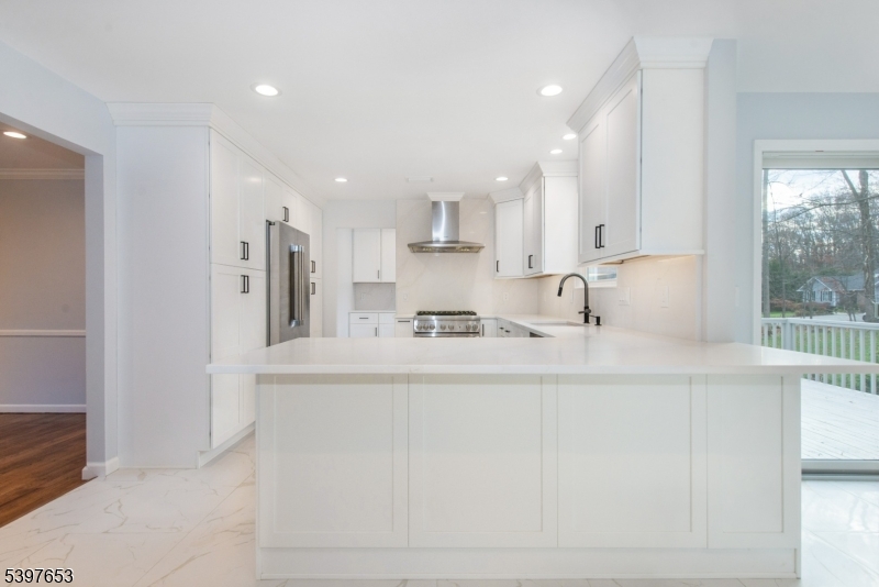 267 Washington Valley Road Randolph, NJ 07869 - Photo 15 of 42 a kitchen with stainless steel appliances granite countertop a sink a stove and a refrigerator