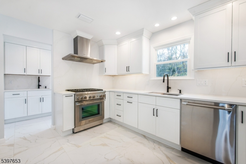 267 Washington Valley Road Randolph, NJ 07869 - Photo 16 of 42 a kitchen with white cabinets stainless steel appliances and sink