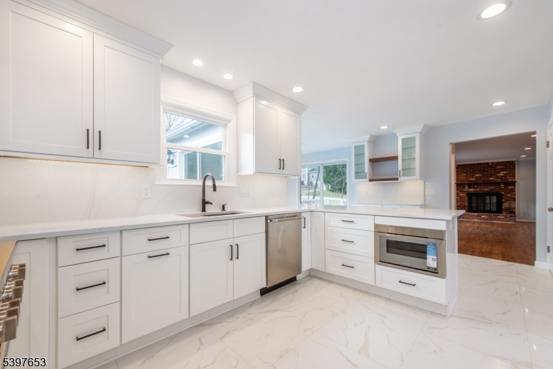267 Washington Valley Road Randolph, NJ 07869 - Photo 17 of 42 a kitchen with white cabinets and sink