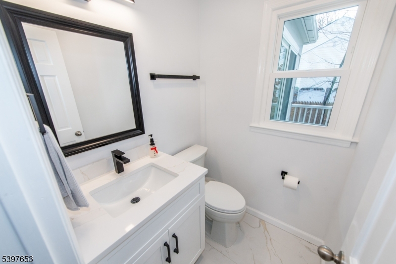 267 Washington Valley Road Randolph, NJ 07869 - Photo 24 of 42 a bathroom with a sink a toilet and a mirror