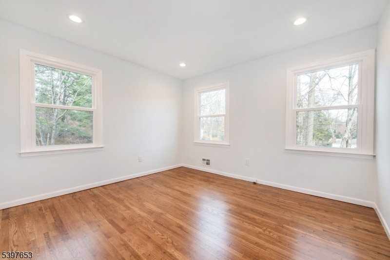 267 Washington Valley Road Randolph, NJ 07869 - Photo 25 of 42 a view of empty room with wooden floor and fan