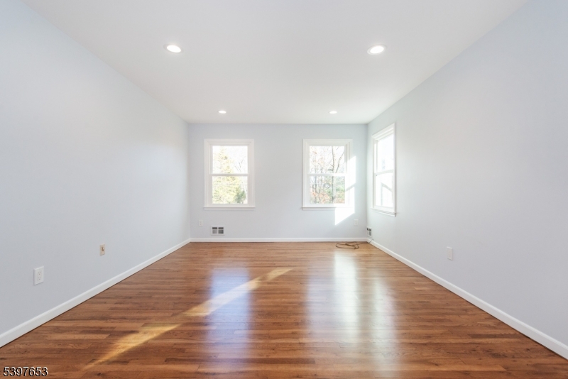 267 Washington Valley Road Randolph, NJ 07869 - Photo 26 of 42 a view of an empty room with wooden floor and window
