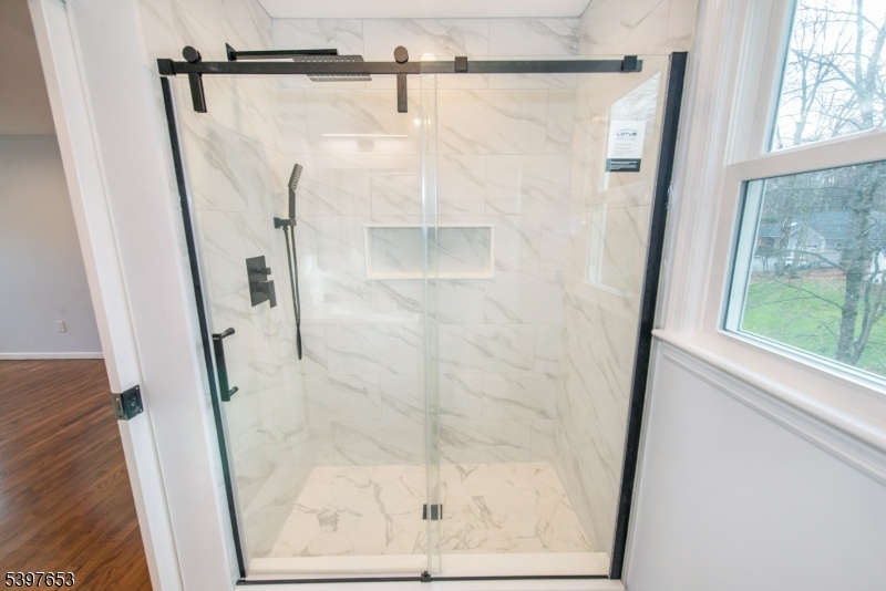 267 Washington Valley Road Randolph, NJ 07869 - Photo 29 of 42 a bathroom with a glass shower door