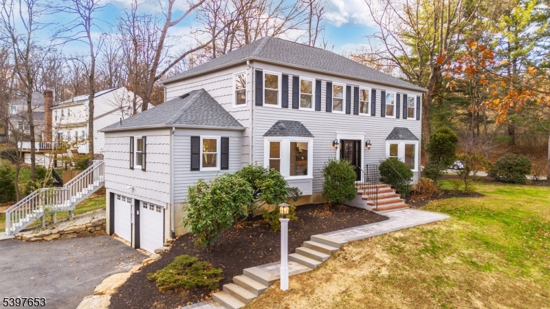 267 Washington Valley Road Randolph, NJ 07869 - Photo 3 of 42 a front view of a house with garden