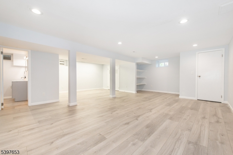 267 Washington Valley Road Randolph, NJ 07869 - Photo 32 of 42 a view of an empty room with wooden floor