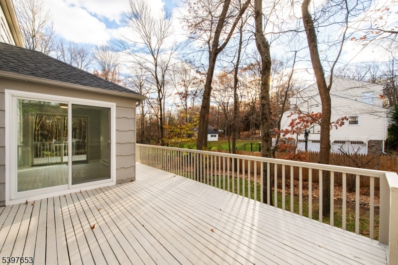 267 Washington Valley Road Randolph, NJ 07869 - Photo 34 of 42 a view of balcony with wooden floor and fence and a trees