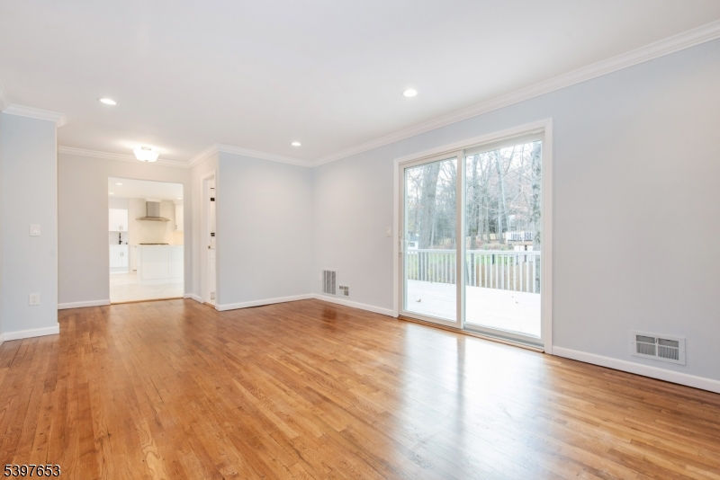 267 Washington Valley Road Randolph, NJ 07869 - Photo 9 of 42 a view of an empty room with wooden floor and a window