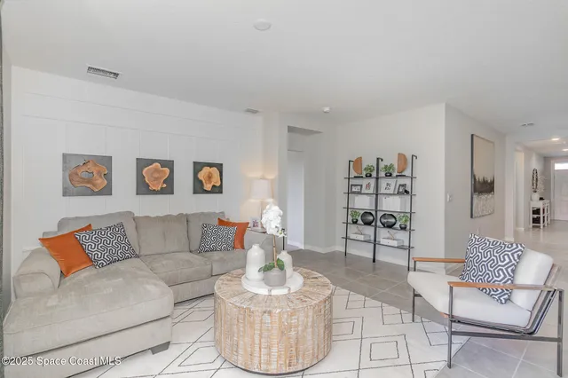 a living room with furniture and a couch