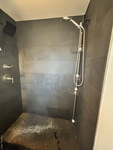 a bathroom with a toilet a sink and a mirror