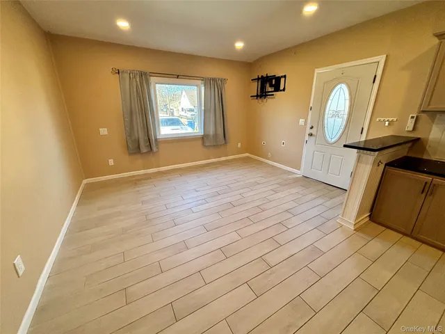 a view of a kitchen with a sink and a stove top oven