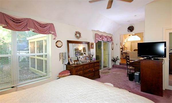 14 Deer Path, Unit 14 Hudson, MA 01749 - Photo 11 of 18 a bedroom with furniture and a flat screen tv