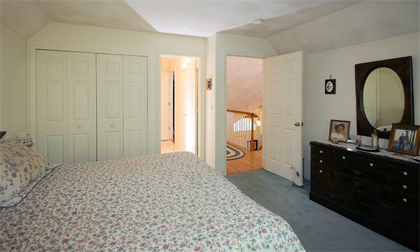 14 Deer Path, Unit 14 Hudson, MA 01749 - Photo 13 of 18 a bedroom with a bed and a dresser