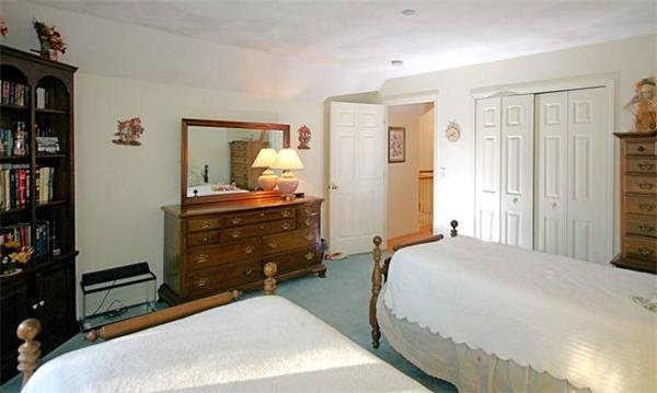 14 Deer Path, Unit 14 Hudson, MA 01749 - Photo 15 of 18 a bedroom with a bed and a cabinets