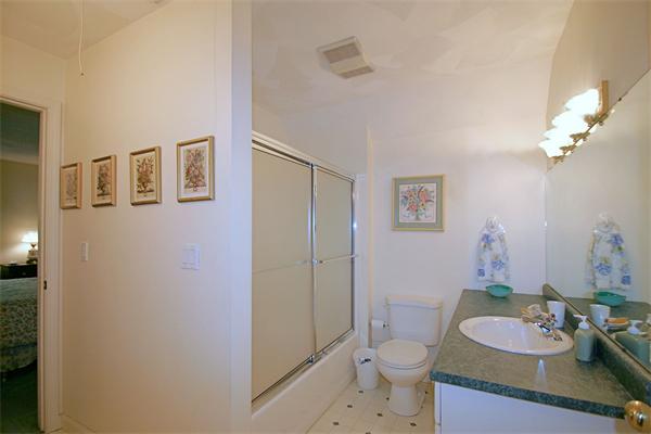 14 Deer Path, Unit 14 Hudson, MA 01749 - Photo 16 of 18 a bathroom with a sink a toilet and shower curtain