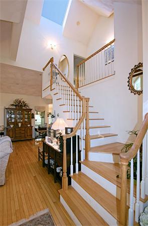 14 Deer Path, Unit 14 Hudson, MA 01749 - Photo 4 of 18 a view of entryway livingroom and hall with wooden floor