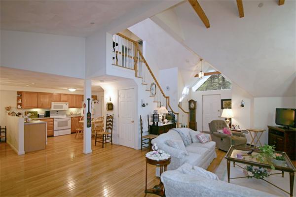 14 Deer Path, Unit 14 Hudson, MA 01749 - Photo 6 of 18 a living room with furniture and kitchen view