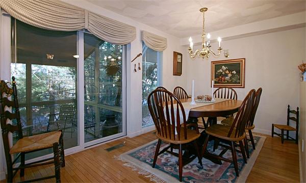 14 Deer Path, Unit 14 Hudson, MA 01749 - Photo 8 of 18 a view of a dining room with furniture window and outside view